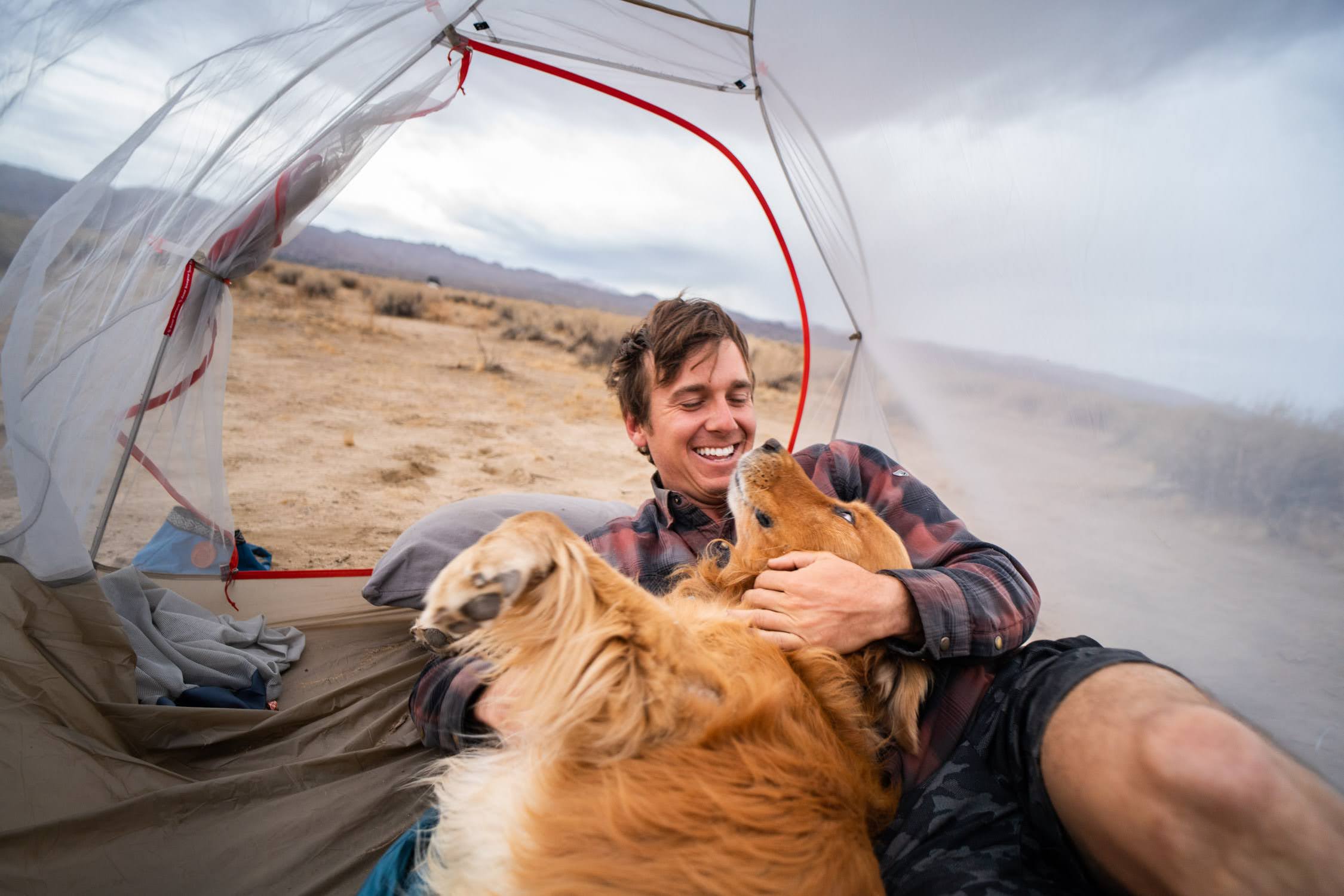 His dog is his camping partner!