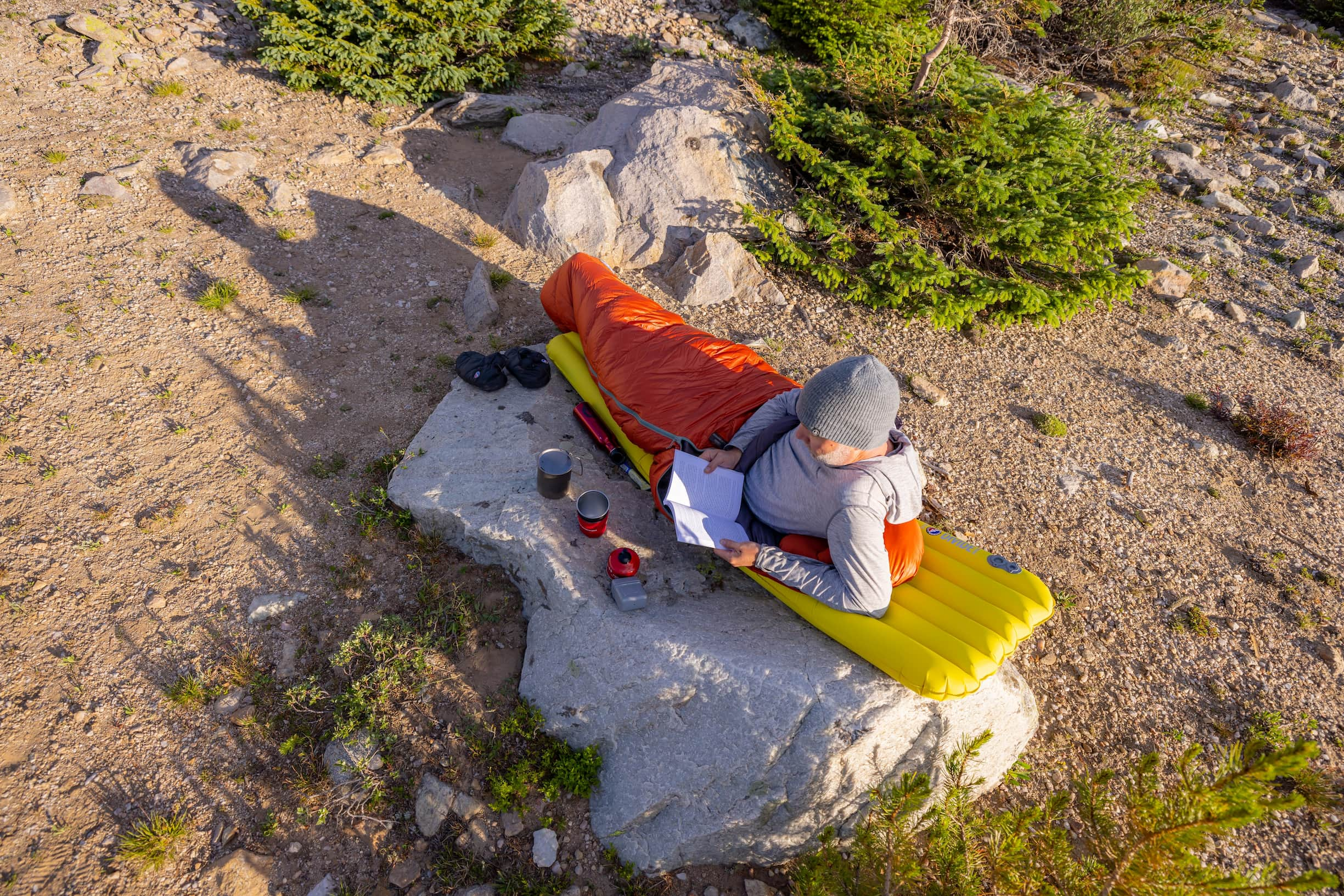 reading a book in a sleeping bag