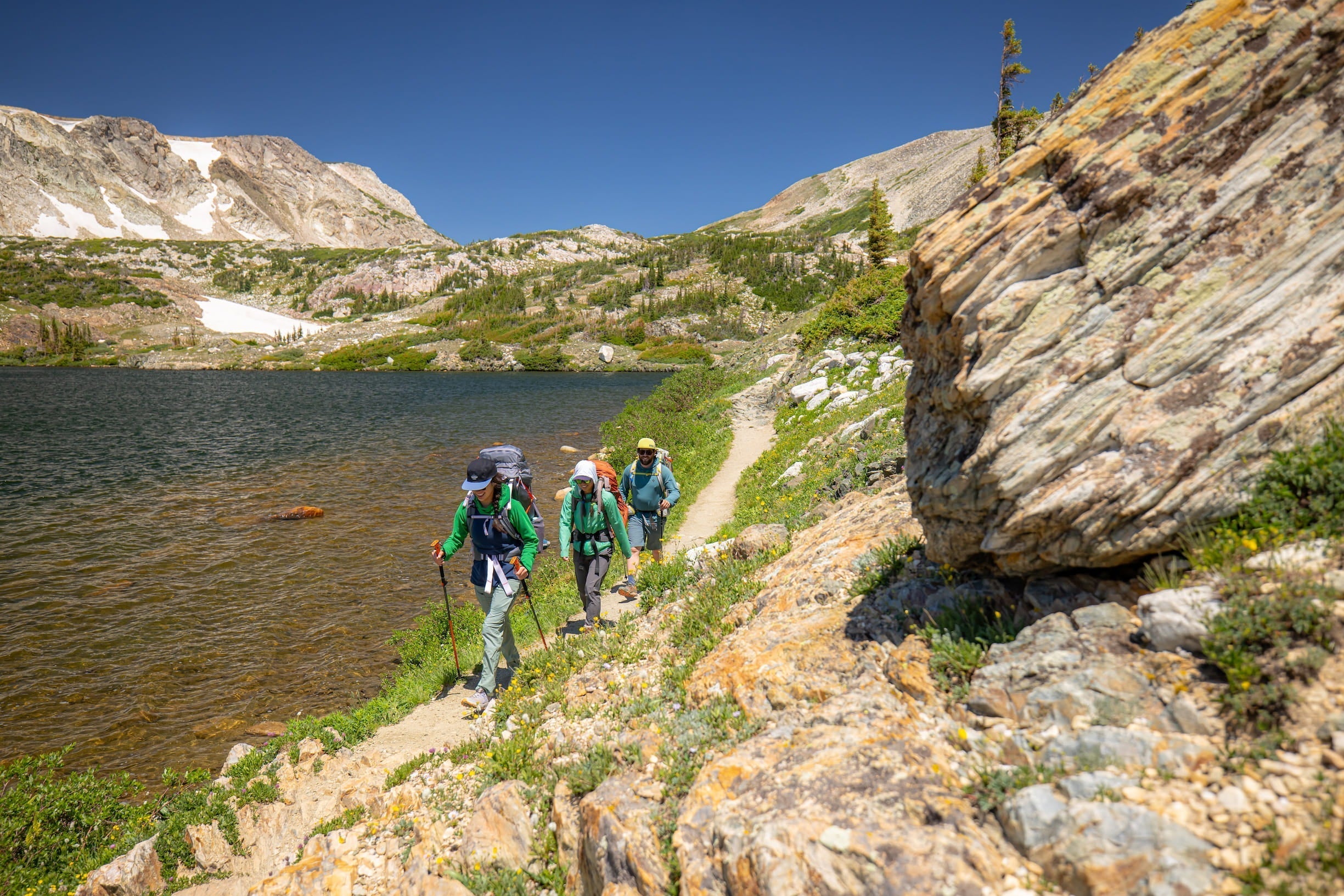 hiking beside a scenic lake