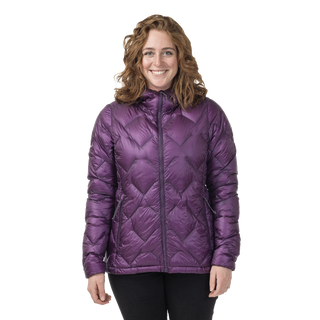 Woman wearing a purple quilted jacket on a white background