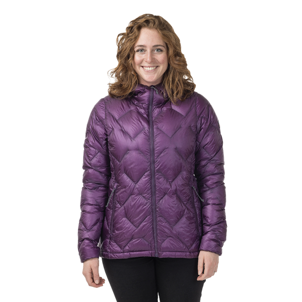 Woman wearing a purple quilted jacket on a white background