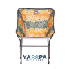 Folding chair with a colorful pattern on a white background, featuring the Yampa River Fund logo.