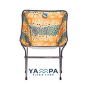 Folding chair with a colorful pattern on a white background, featuring the Yampa River Fund logo.