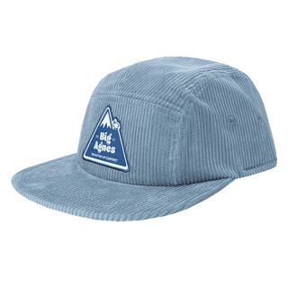 Blue corduroy cap with a logo on a white background