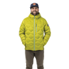 A man wearing a green Grenoble Green/Granite Green M’s Shovelhead Jacket with a blue zipper and dark trousers.