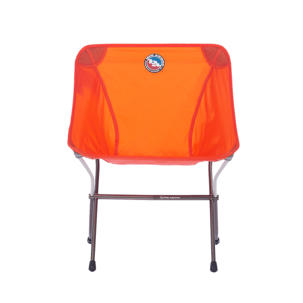 Orange folding chair with a logo on a white background