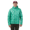 A person wearing a bright green, diamond-quilted Big Agnes Europe M’s Zetto UL Jacket with an ultralight hooded design.
