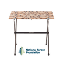 Portable folding table with a patterned top on a white background, featuring the National Forest Foundation logo.